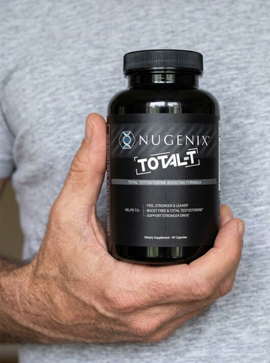 Holding a bottle of Nugenix Total-T