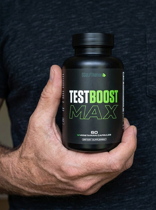 Holding a bottle of TestBoost Max