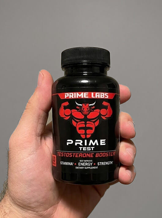 Holding a bottle of Prime Labs Prime Test